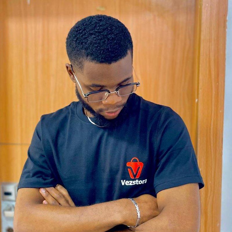 Victor Eze, founder of Vezstora, wearing a Vezstora T-shirt