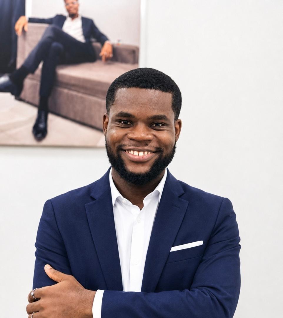 Portrait of Victor Eze in a navy suit